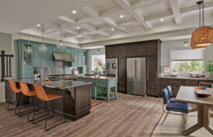 kitchen color ideas 2026 showing sage green cabinets with warm white walls and black hardware