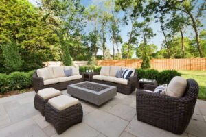 Outdoor garden furniture and seating area decorated with cushions and lanterns 