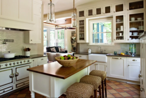 Kitchen countertop decor with wooden board, plant, ceramic canisters and tray