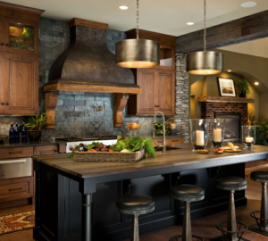 Kitchen island decor with wooden stools, pendant lights and fresh flowers