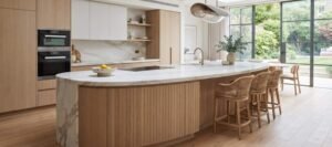 Kitchen island with bar stools and a separate dining table in a modern open-plan layout